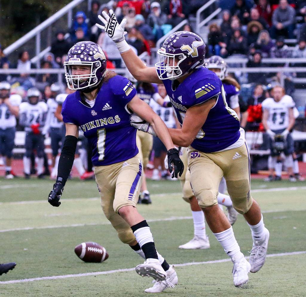 Lake Stevens Gabe Ramsey (left) and Tyler Hilton celebrate Ramsey late interception to seal the victory over Union Saturday afternoon at Lake Stevens High School on November 16, 2019. Lake Stevens won 28-21. (Kevin Clark / The Herald)