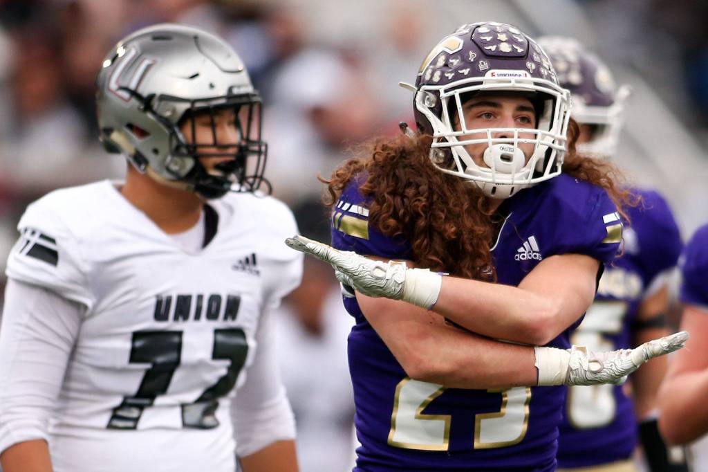 Lake Stevens Xander Fogel celebrates a tackle with no yards Saturday afternoon at Lake Stevens High School on November 16, 2019. Lake Stevens won 28-21. (Kevin Clark / The Herald)