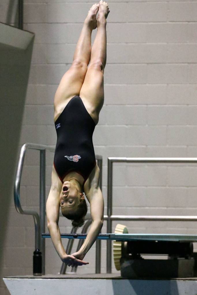 Snohomishs Kayli Kersavage competes in the 1 meter diving Saturday evening during the 3A Girls Swim & Dive Championship at King County Aquatics Center in Federal Way on November 16, 2019. (Kevin Clark / The Herald)