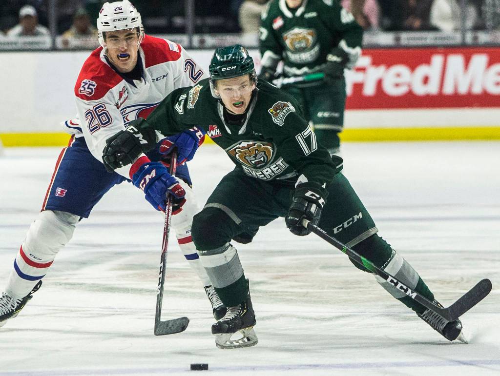 Silvertips Jackson Berezowski beats Spokanes Jack Finley to the puck during the game against the Spokane Chiefs on Nov. 17, 2019 in Everett, Wash. (Olivia Vanni / The Herald)