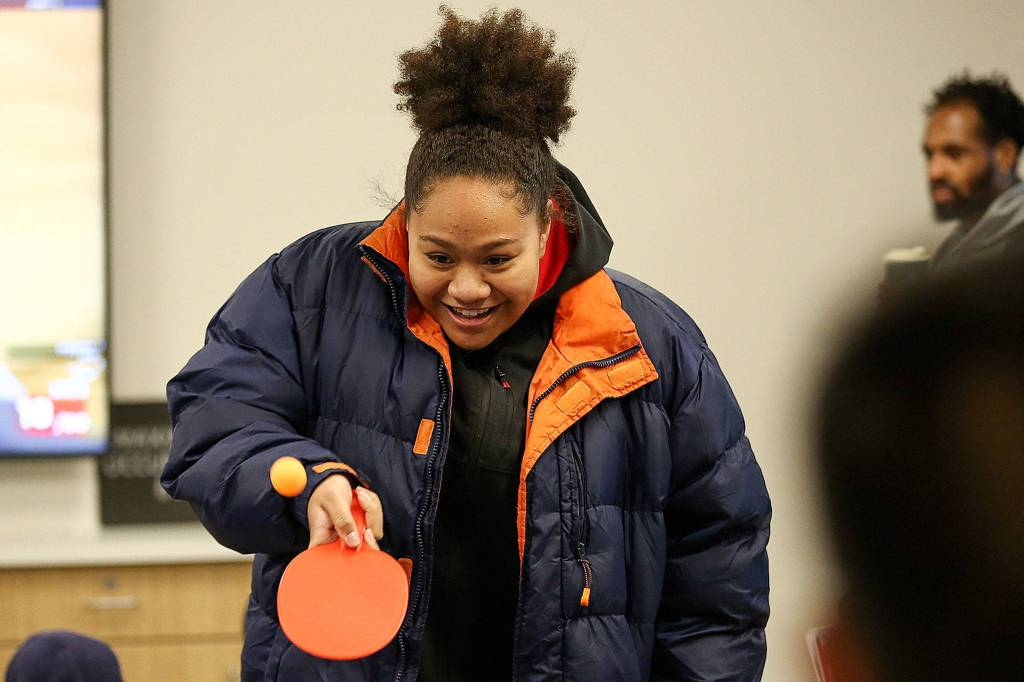 Anna Kunawave plays ping-pong in the soon-to-be opened Everett YMCA after the ribbon cutting ceremony Saturday morning. (Kevin Clark / The Herald)