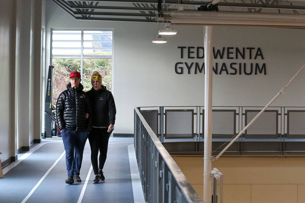 Guests tour the track of the soon-to-be opened Everett YMCA after the ribbon cutting ceremony Saturday. (Kevin Clark / The Herald)