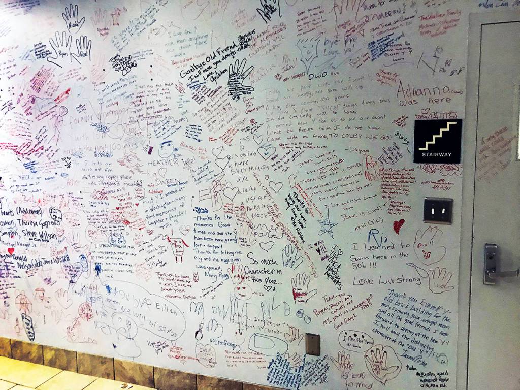 Members signed a wall with goodbyes near a stairway in the lobby of the former Everett YMCA before it closed Nov. 16. (Stephanie Davey / The Herald)