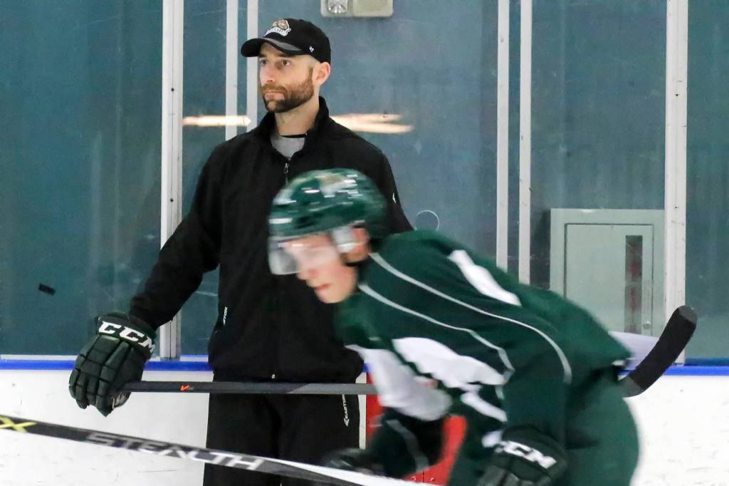 Everett Silvertips assistant coach Mitch Love looks on during a practice session in 2015. (Kevin Clark / Herald file)