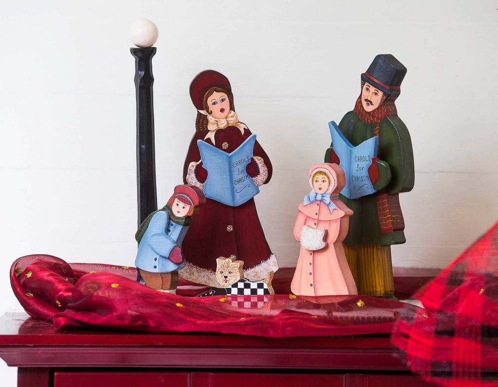 Bill Leeses parents painted these caroler figurines. (Andy Bronson / The Herald)