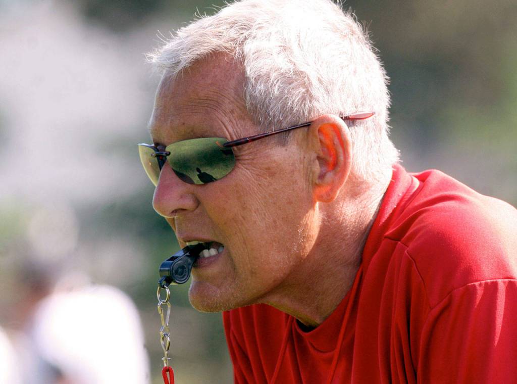 Archbishop Murphy head coach Terry Ennis watches his players as he gets ready to blow the whistle during a practice in 2007 at Archbishop Murphy High School in Everett. (Chris Goodenow / Weekly Herald)