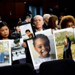 People holding photos of those lost in Ethiopian Airlines Flight 302 and Lion Air Flight 610 wait for the start of a Senate Committee on Commerce, Science, and Transportation hearing on Capitol Hill in Washington, on Oct. 29. (AP Photo/Susan Walsh)