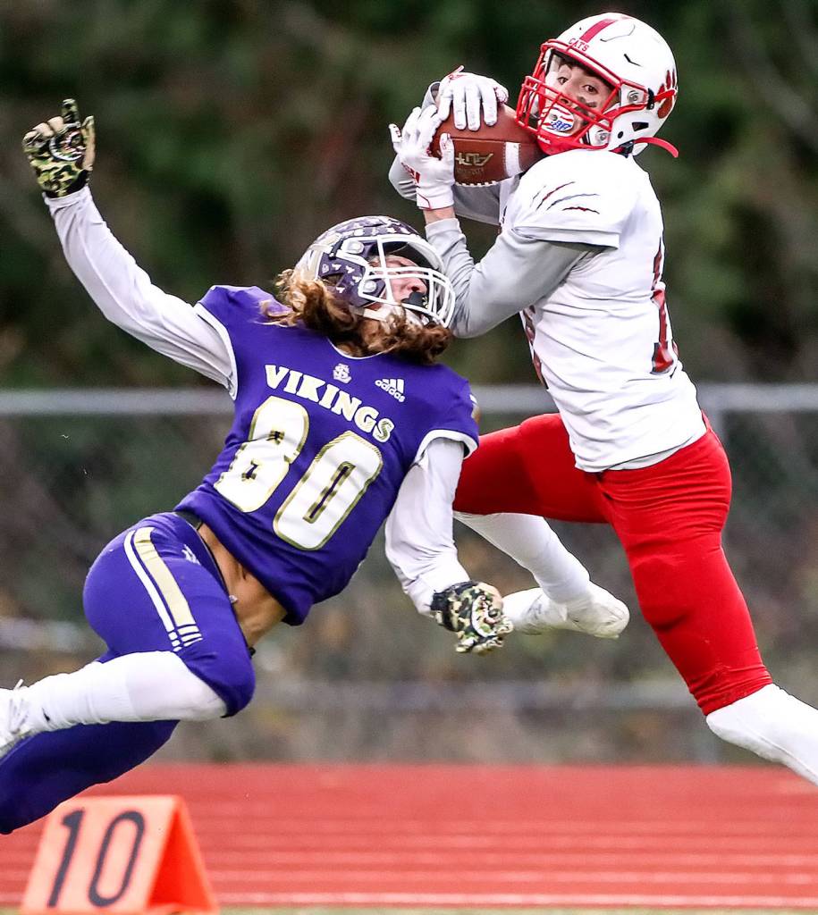 Mount Sis Andrew Mostofi makes a touchdown reception over Lake Stevens Drew Carter Saturday afternoon at Lake Stevens High School on November 23, 2019. Lake Stevens lost to Mount Si, 24-22, ending their state championship run. (Kevin Clark / The Herald)