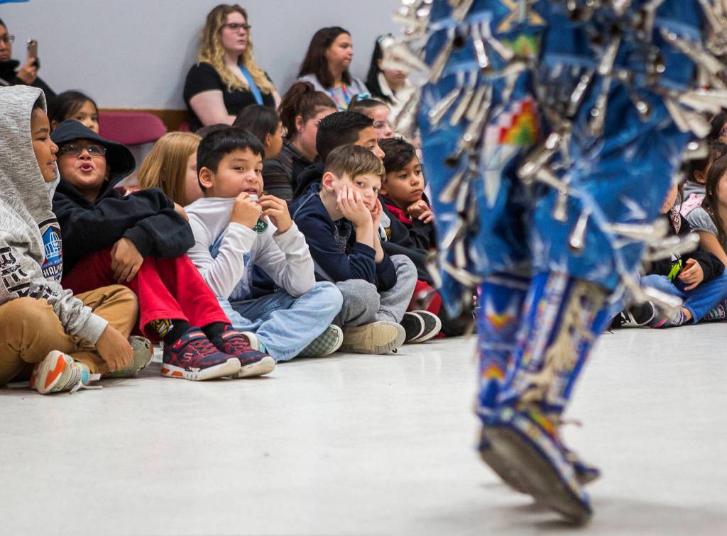 Students watch the footwork of the dancers.