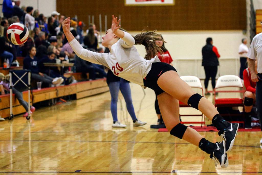 Snohomishs Lauren Riske makes a dive against Oak Harbor on Nov. 14 at Marysville-Pilchuck High School. (Kevin Clark / The Herald)