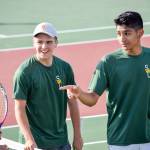Shorecrests Ben Silber (middle) and Zaid Khan (right) talk to their opponents, Shintaro Wilcox and Preston Pierce, from Stanwood after winning the 3A Northwest District Tournament doubles final Oct. 30 at Arlington High School. (Katie Webber / The Herald)
