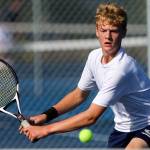 Everetts Aaron Robertson returns volley against Arlington on Sept. 19 at Clark Park in Everett. (Kevin Clark / The Herald)