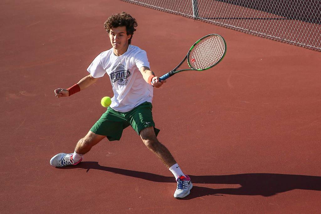 Edmonds-Woodways Sebastian Fernandez competes in the 3A Boys District Tennis Tournament on Oct. 29 at Arlington High School. (Kevin Clark / The Herald)