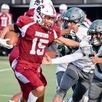 Senior running back Davanta Murphy-Mcmillan stiff-arms a Mount Vernon defender on Friday, Sept. 20 at Everett Memorial Stadium. (Katie Webber / The Herald)