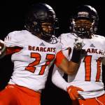 Trey Lane (left), Josh Young and the Monroe Bearcats square off against Glacier Peak in a pivotal Wesco 4A clash on Friday night. (Kevin Clark / The Herald)