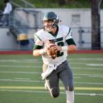 Senior quarterback Skyler Jensen looks for an open receiver against Cascade on Friday, Sept. 20 at Everett Memorial Stadium. (Katie Webber / The Herald)