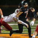 Monroe’s Gio Fregoso is sacked during the 4A playoff game against Mount Si on Nov. 9, 2019 in Monroe, Wash. (Olivia Vanni / The Herald)