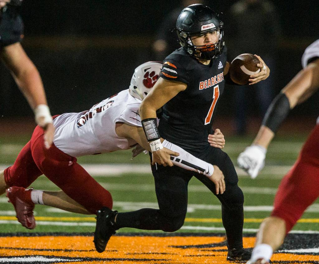 Monroe’s Gio Fregoso is sacked during the 4A playoff game against Mount Si on Nov. 9, 2019 in Monroe, Wash. (Olivia Vanni / The Herald)