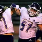 Lake Stevens Gabe Ramsey (left) and Austyn Rembold-Hyde celebrate Friday night at Lincoln Bowl in Tacoma on September 13, 2019. Lake Stevens won 35-26. (Kevin Clark / The Herald)