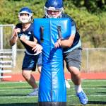 Senior Alex Krueger practices lineman drills at Meadowdale High School on Thursday, Aug. 22. (Katie Webber / The Herald)