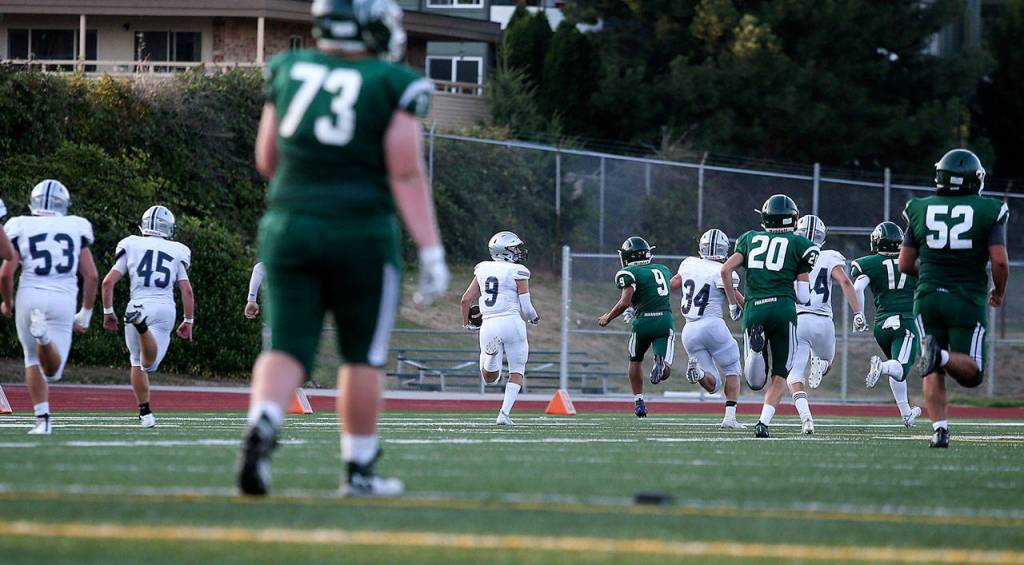Glacier Peaks Ryan Kinney (9) runs a blocked field goal attempt in for a 70 yard touchdown as Glacier Peak beat Edmonds-Woodway 35-14 at Edmonds Stadium on Friday, Sept. 6, 2019 in Edmonds, Wash. (Andy Bronson / The Herald)