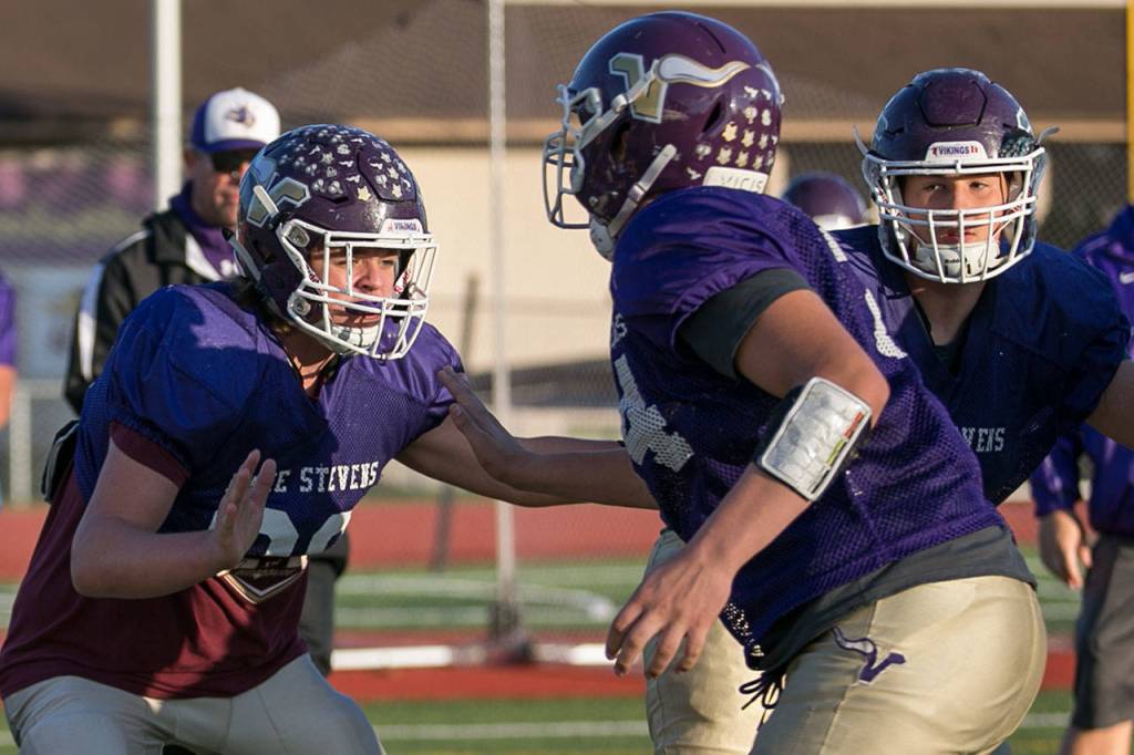 Logan Bruce-Jones (left) and Austyn Rembold-Hyde (right) runs through drills Wednesday afternoon during practice at Lake Stevens on November 7, 2018. (Kevin Clark / The Herald)