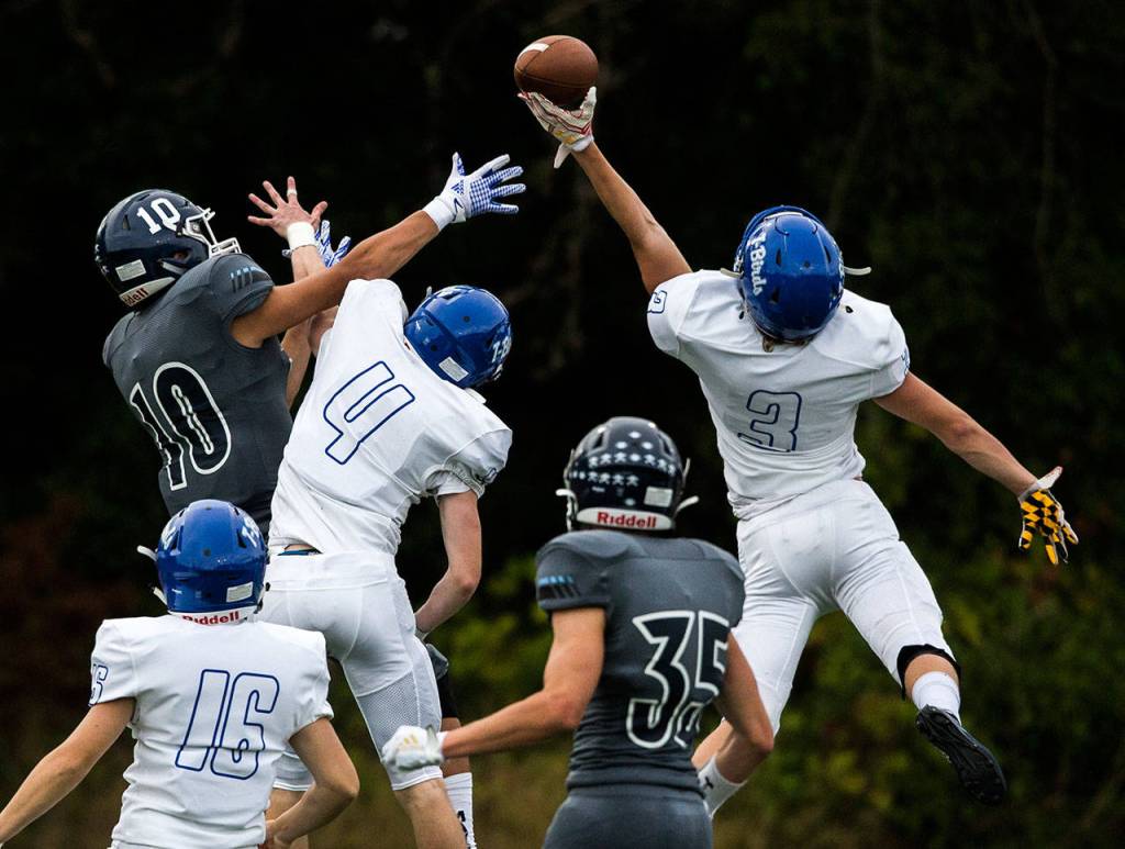 Shorewoods Spencer Osborn blocks a pass to Meadowdales Colton Walsh during the game on Friday, Sept. 13, 2019 in Edmonds, Wash. (Olivia Vanni / The Herald)