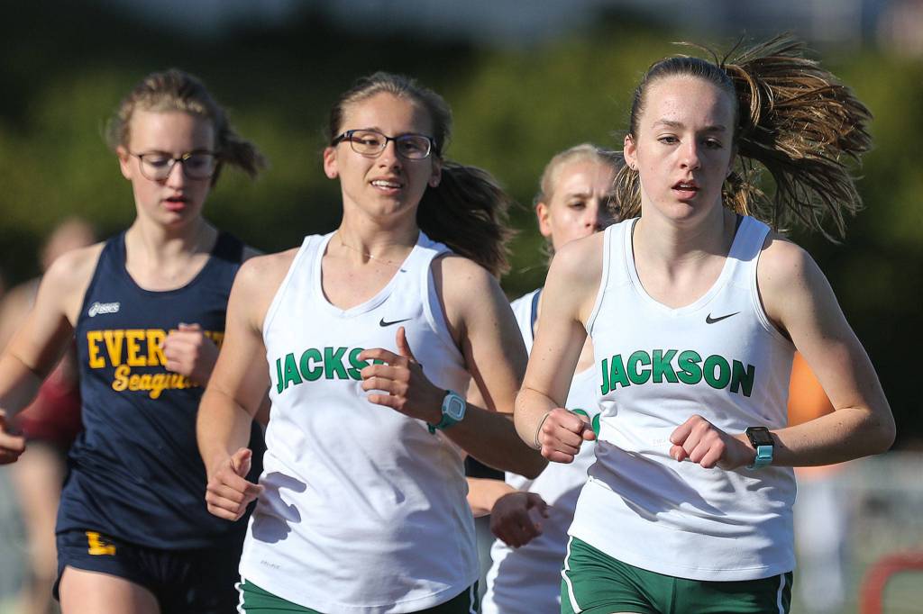 Jacksons Anna Skoog (left) lead the pack early in the 3200 meter run to a second place finish Friday afternoon during the Everett City Championships at Everett Memorial Stadium on May 3, 2019. (Kevin Clark / The Herald)