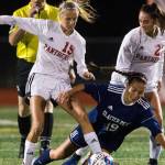 Snohomishs Kayla Soderstorm and Ravyn Mummey trip up Glacier Peaks Emily Strong during the game on Tuesday, Sept. 10, 2019 in Snohomish, Wash. (Olivia Vanni / The Herald)