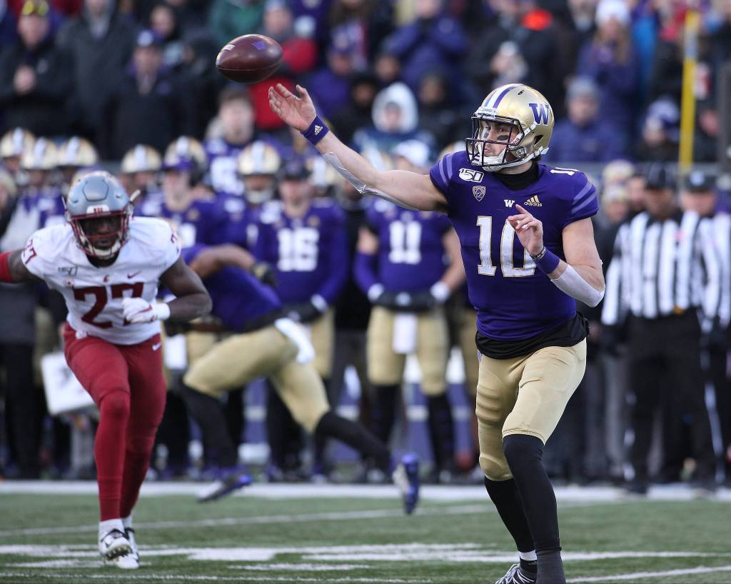 Washington Huskies quarterback Jacob Eason (10) throws a pass as the Washington State University Cougars lost 31-13 to the University of Washington Huskies in the 112th Apple Cup at Husky Stadium on Friday, Nov. 29, 2019 in Seattle, Wash. (Andy Bronson / The Herald)