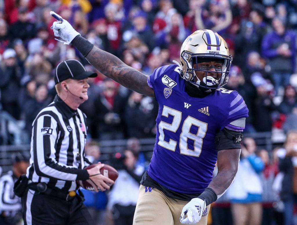 Washington Huskies running back Richard Newton (28) celebrates his touchdown during the 112th Apple Cup Friday afternoon at Alaska Airlines at Husky Stadium on November 29, 2019. The Huskies won 31-13. (Kevin Clark / The Herald)