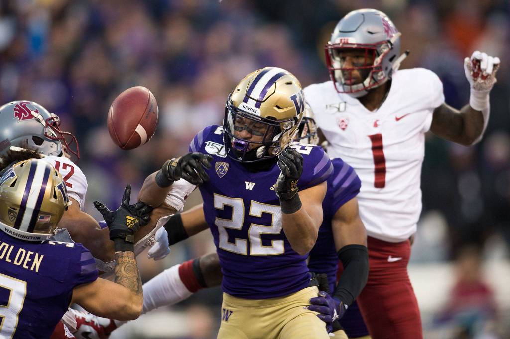 Washington Huskies defensive back Trent McDuffie (22) breaks up a pass intend for Washington State Cougars wide receiver Dezmon Patmon (12) as the Washington State University Cougars lost 31-13 to the University of Washington Huskies in the 112th Apple Cup at Husky Stadium on Friday, Nov. 29, 2019 in Seattle, Wash. (Andy Bronson / The Herald)