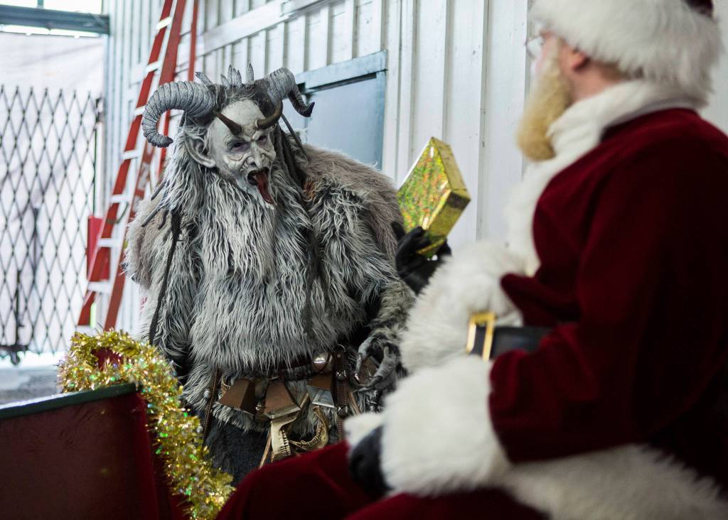 Krampus interacts with Santa Claus at the Oddmall: Emporium of the Weird in Monroe. (Olivia Vanni / The Herald)
