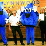 Council President Benjamin Goodwin presents the business award to the president and general manager of Mr. Kleen 76 Station, Dan Kestle and his staff members. (City of Lynnwood)