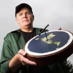 Mark Sargent, known worldwide for his flat-Earth beliefs, shows a representative model at his home on Whidbey Island. (Andy Bronson / The Herald)