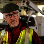 Dennis Kelly, a Catholic deacon (left), talks with Dr. Jimmy Grierson, a MercyWatch volunteer. (Dan Bates / The Herald)