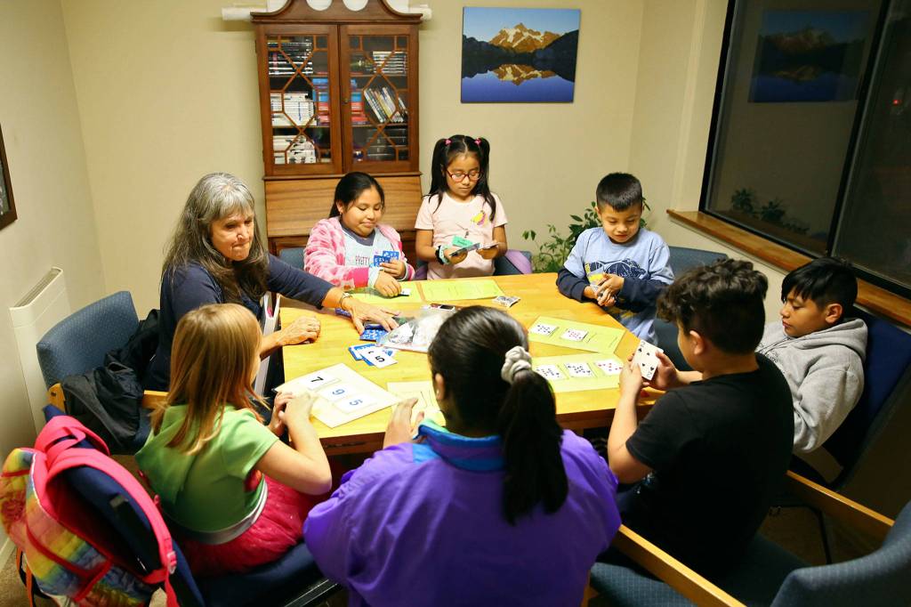 Linda Kypreso leads a math group in Monroe on Nov. 19. (Kevin Clark / The Herald)