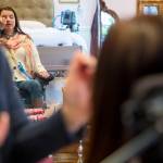 Lindsey Holland, a nurse, puts eye shadow on Loa Griesbach. (Olivia Vanni / The Herald)