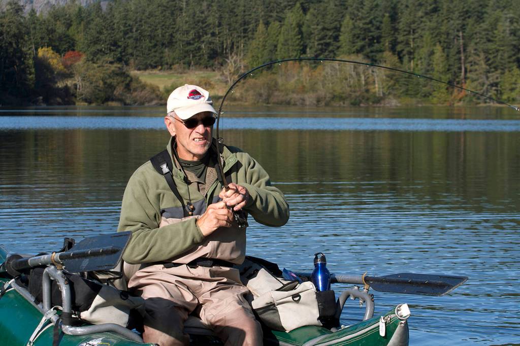 A rainbow trout caught in deeper water puts up a good fight at Pass Lake. (Mike Benbow)