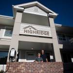 Rosy Addington (left) and Jim Addington stand outside the newly constructed Highridge Apartments on Nov. 29 in Everett. (Olivia Vanni / The Herald)