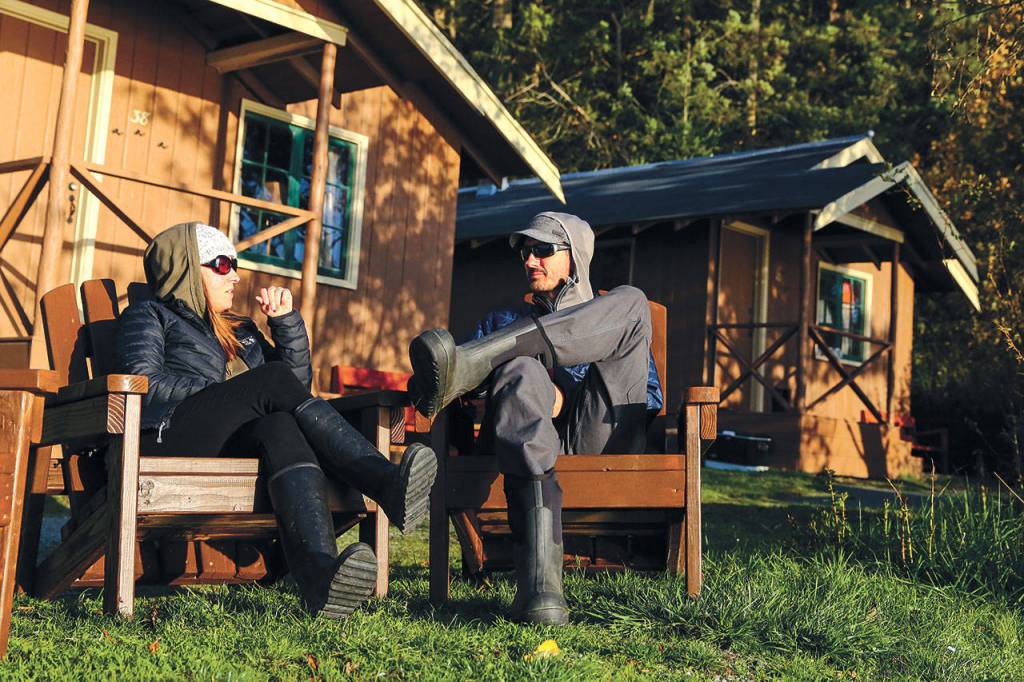 Michelle and Dan Layton of Indianola in Kitsap County enjoy a cool but sunny day on their annual trip to Cama Beach Historical State Park. (Kevin Clark / The Herald)