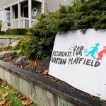 A sign expresses an opinion in front of a home across the street from the Norton Ball Field on Wednesday morning. (Sue Misao / The Herald)