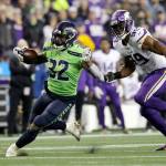 Seattle Seahawks Chris Carson cuts upfield ahead of Minnesotas Danielle Hunter during the Seahawks 37-30 win over the Vikings on Monday at CenturyLink Field in Seattle. (AP Photo/Ted S. Warren)