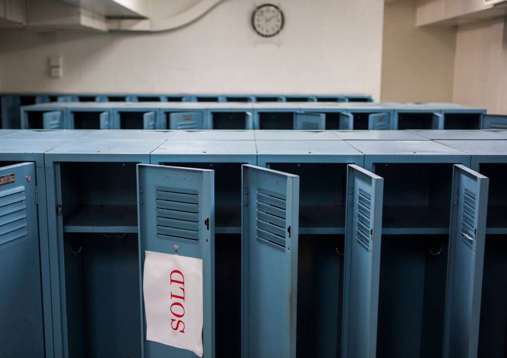 Dusty lockers sit open with a sold sign. (Olivia Vanni / The Herald)