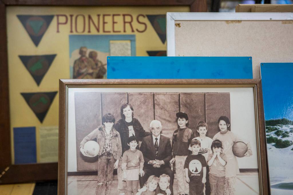 Old photos sit in a gym. (Olivia Vanni / The Herald)