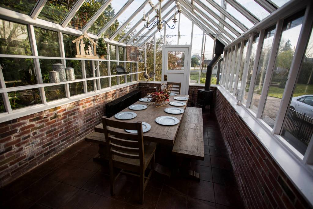 A greenhouse converted to a dining area in the 604 Main Street VRBO in Monroe. (Olivia Vanni / The Herald)