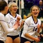Samaya Morin (center) celebrates a point with her teammates during the Vikings state-clinching bi-district tournament sweep of Mount Si earlier this month. (Kevin Clark / The Herald)