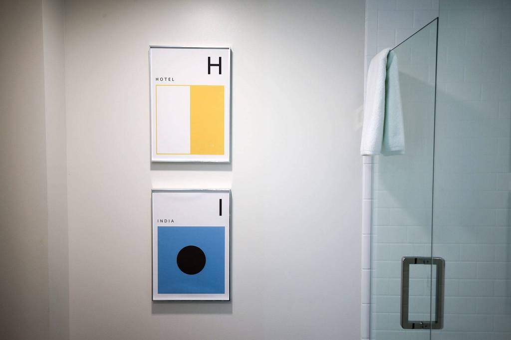 U.S. Navy Signal flags are hung in the bathrooms at the Hotel Indigo Everett. (Andy Bronson / The Herald)