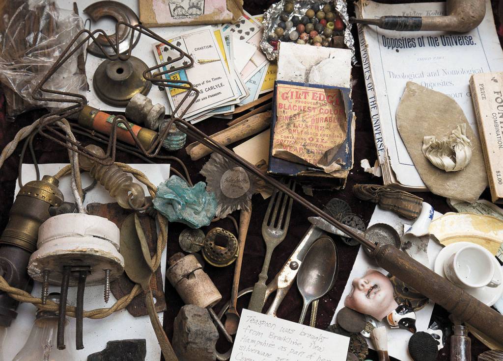 A display box in the foyer is filled with long-hidden artifacts the Pickfords found while working on the home. (Andy Bronson / The Herald)