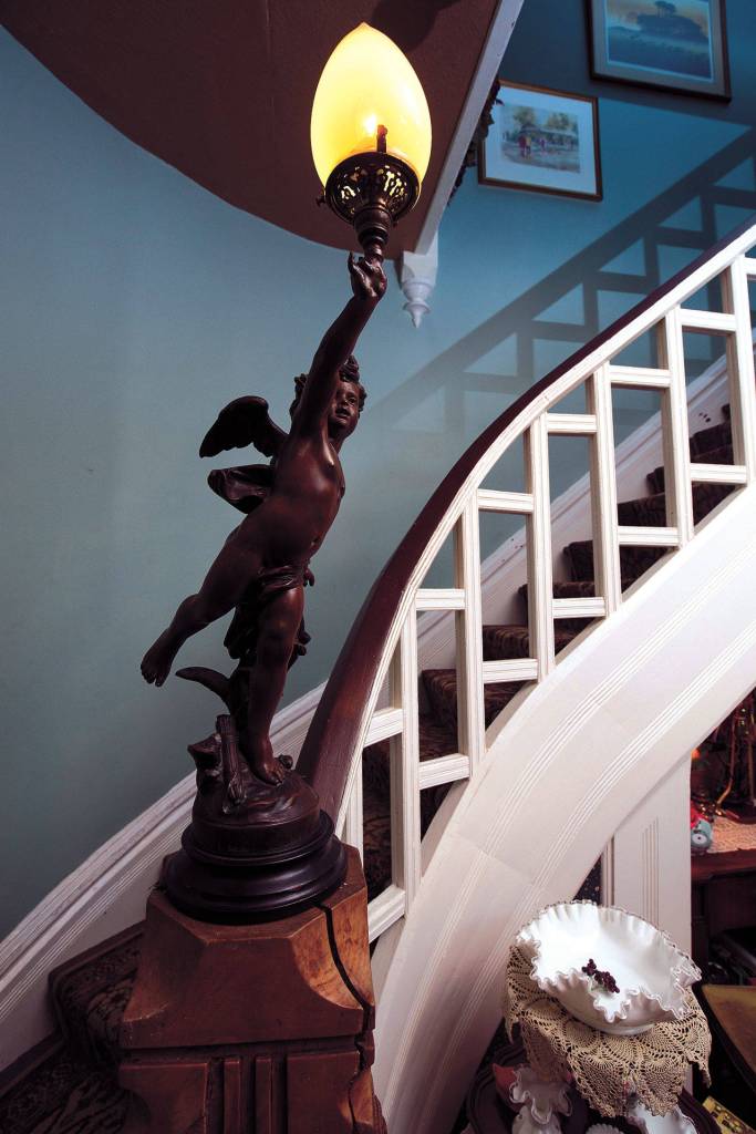 A curved staircase leads to the second floor of Lisa and Stew Pickfords house. The Victorian home has been a favorite of the Snohomish Historical Societys annual Christmas Parlor Tour. (Andy Bronson / The Herald)